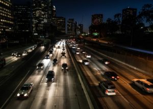 cars driving on the highway at night
