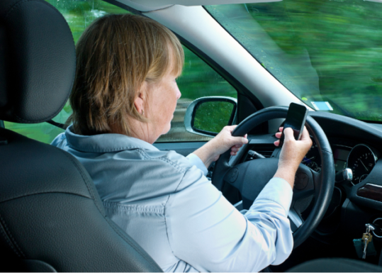 Woman texting and driving